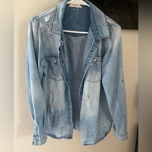 Distressed denim over shirt